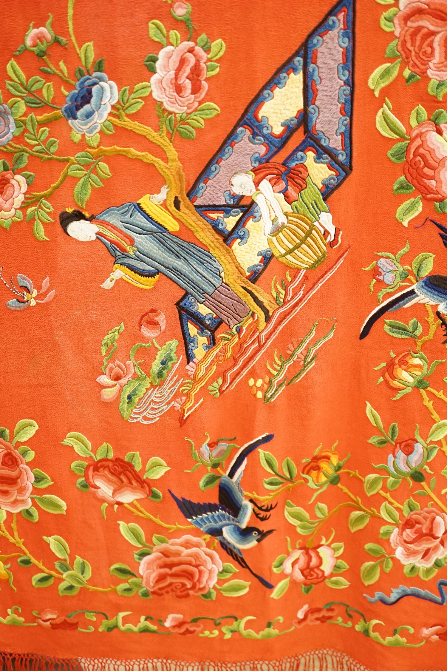 A Chinese early 20th century silk crepe, polychrome embroidered shawl